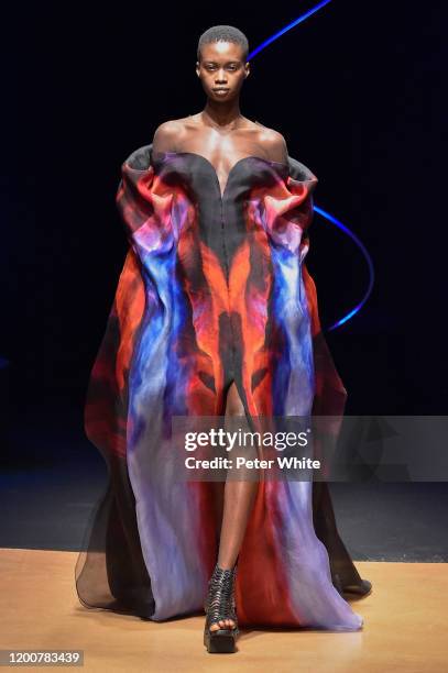 Fatou Jobe walks the runway during the Iris Van Herpen Haute Couture Spring/Summer 2020 show as part of Paris Fashion Week on January 20, 2020 in...