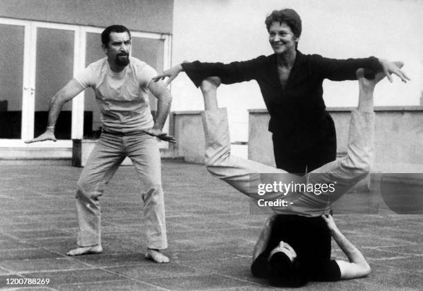 French Choregrapher Maurice Béjart directs French actress Maria Casares and dancer Germinal Casado 11 July 1968 during a rehearsal of the ballet...