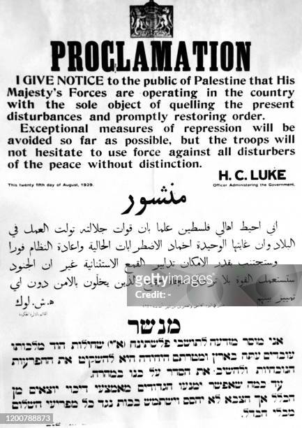 Picture taken in August 1929 during the British mandate in Palestine shows a warning proclamation by the British authority as violent clashes occur...