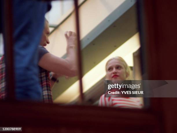 Singer Madonna listens to French designer Jean-Paul Gaultier, 09 October 1992 during her visit in France to present her album "Erotica" and her book...