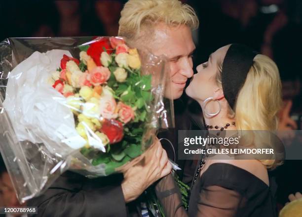 Singer Madonna congratulates French designer Jean-Paul Gaultier, 19 October 1990, after his ready-to-wear Spring/Summer 91 collection, in Paris....