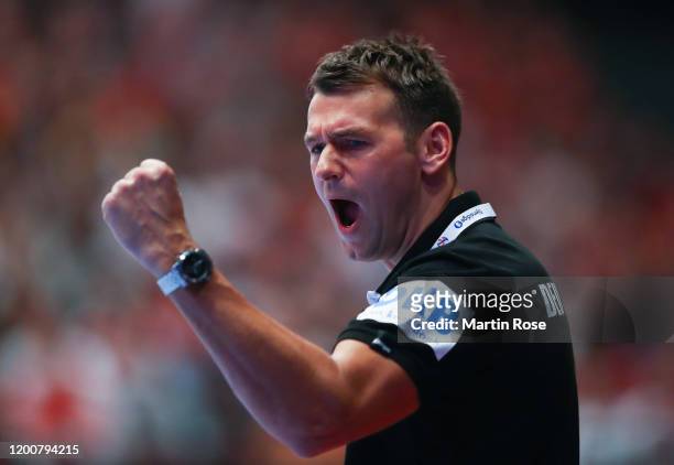 Christian Prokop, head coach of Germany celebrates during the Men's EHF EURO 2020 main round group I match between Austria and Germany at Wiener...