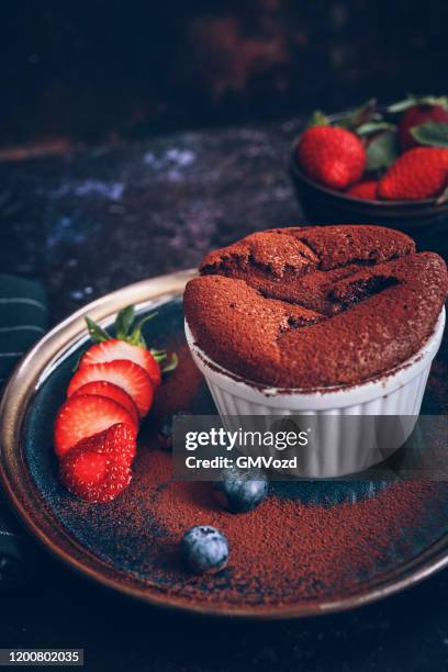 chocolate souffle served with strawberries - chocolate souffle stock pictures, royalty-free photos & images