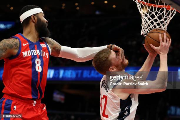 Davis Bertans of the Washington Wizards is fouled by Markieff Morris of the Detroit Pistons during the second half at Capital One Arena on January...