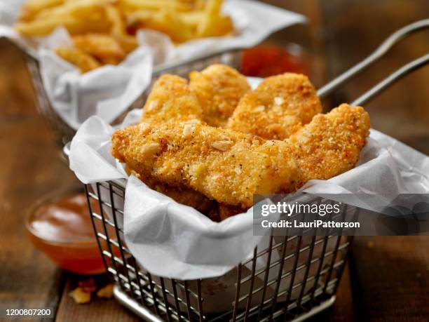vegan, meatless-plant based protein chicken strips with a seven grain coating and fries - french fries basket stock pictures, royalty-free photos & images