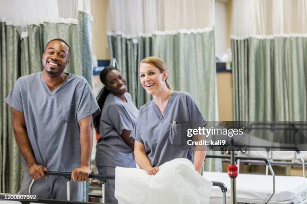 healthcare workers in hospital recovery room - hospital cleaning stock pictures, royalty-free photos & images