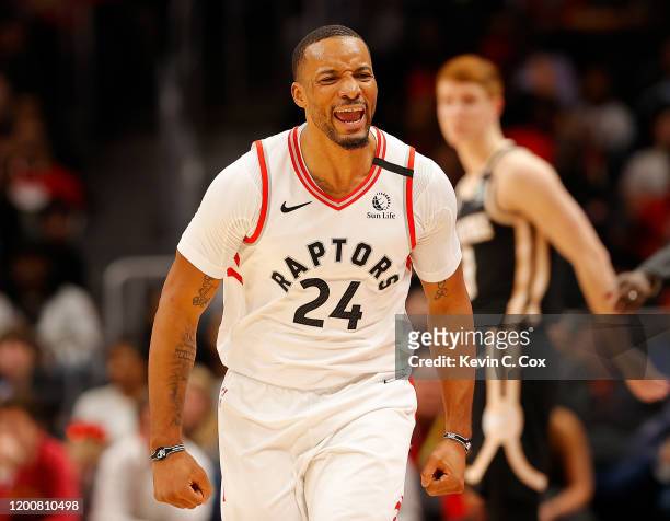 Norman Powell of the Toronto Raptors reacts after hitting a three-point basket against the Atlanta Hawks in the second half at State Farm Arena on...
