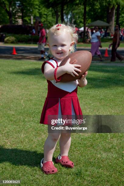 Young football fan attends attends A-Day, the annual University of Alabama spring practice scrimmage game, Tuscaloosa, Alabama, 2010.