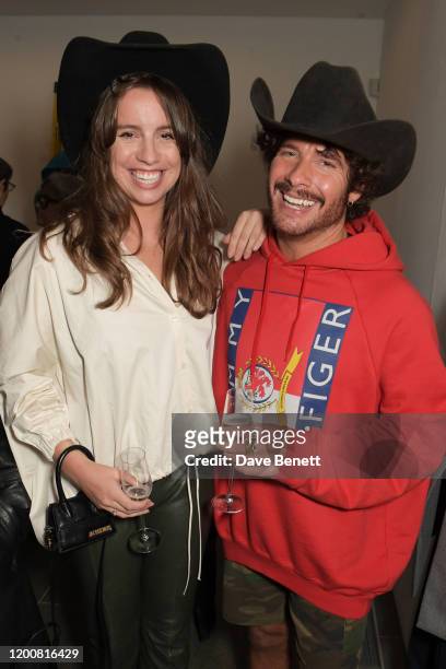 Annie Doble and Editor of GQ Style Luke Day attend the Vivienne Westwood AW20/21 presentation and exhibition during London Fashion Week February 2020...
