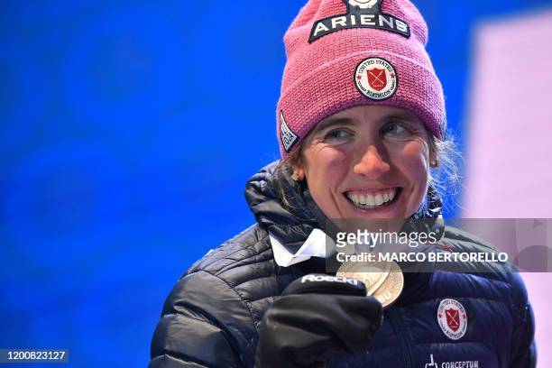 Skier Susan Dunklee poses with her silver medal, on the podium after the IBU Biathlon World Cup 7,5 km Women's sprint in Rasen-Antholz , Italian...