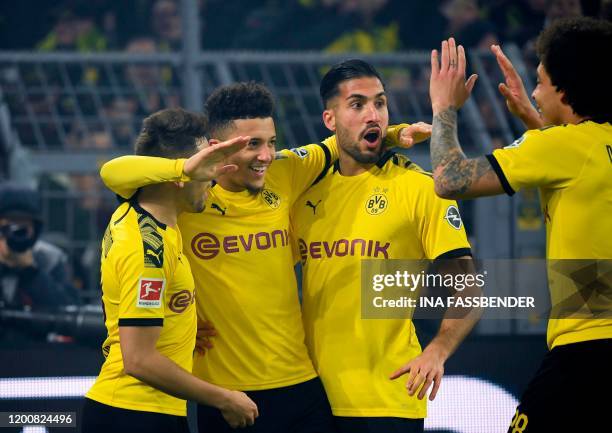 Dortmund's French midfielder Raphael Guerreiro, Dortmund's English forward Jadon Sancho, Emre Can and Dortmund's Belgian midfielder Axel Witsel...