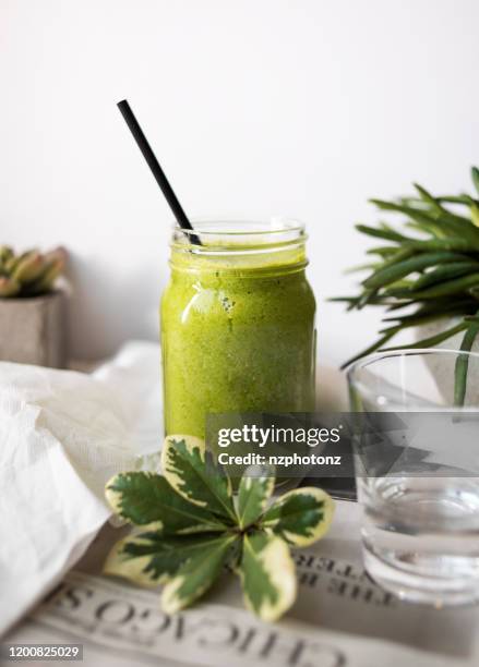 spinach smoothie  (click for more) - milkshakes stock pictures, royalty-free photos & images