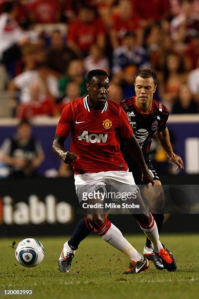 Danny Welbeck of the Manchester United controls the ball against Jack Jewsbury of the MLS All-Stars during the MLS All-Star Game at Red Bull Arena on...