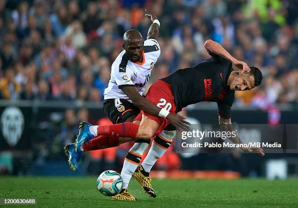 Eliaquim Mangala of Valencia competes for the ball with Vitolo of Atletico de Madrid during the Liga match between Valencia CF and Club Atletico de...