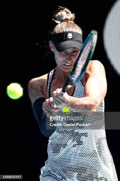 Polona Hercog of Slovenia plays a backhand during her Women's Singles first round match against Rebecca Peterson of Sweden on day two of the 2020...