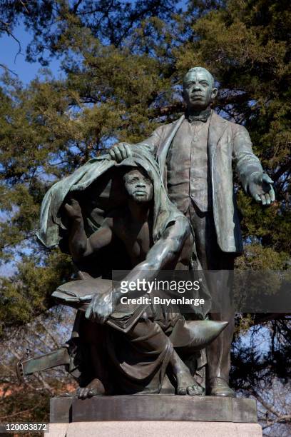 Statue of American Civil Rights leader, politician, and author Booker T. Washington entitled 'Lifting the Veil of Ignorance,' on the campus of...