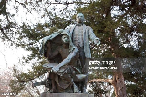 Statue of American Civil Rights leader, politician, and author Booker T. Washington entitled 'Lifting the Veil of Ignorance,' on the campus of...