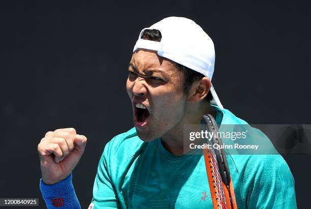 Tatsuma Ito of Japan celebrates after winning match point during his Men's Singles first round match against Prajnesh Gunneswaran of India on day two...