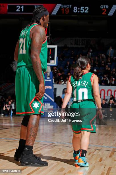 Darius Miles and Katelyn Ohashi of Team Stephen A stand on the court during the NBA Celebrity Game Presented By Ruffles as part of 2020 NBA All-Star...