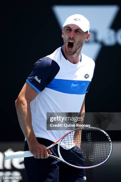 John Millman of Australia celebrates after winning a point during his Men's Singles first round match against Ugo Humbert of France on day two of the...