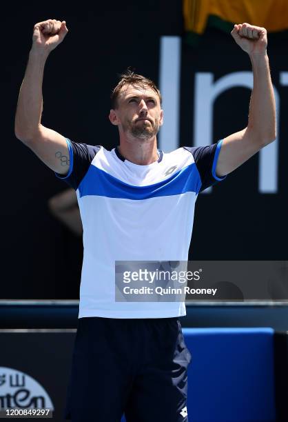 John Millman of Australia celebrates after winning match point during his Men's Singles first round match against Ugo Humbert of France on day two of...