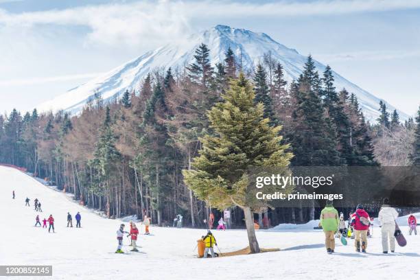 mount fuji view with crowd tourists enjoy of ski resort fujiyama top beautiful in japan beautiful landscape in winter time at fujiten ski resort - japan skiing stock pictures, royalty-free photos & images