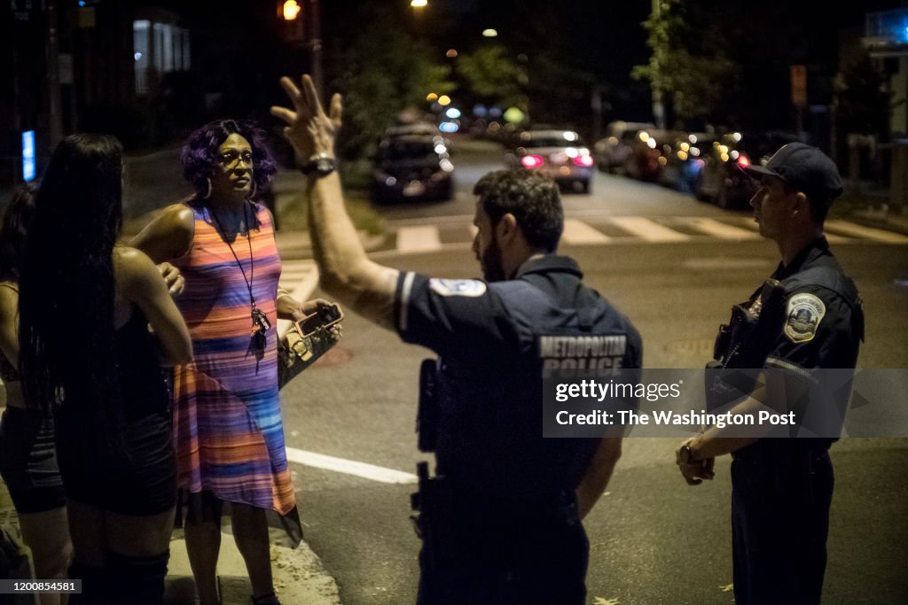 Tamika Spellman speaks with DC police officers responding to a call about an altercation between two sex workers during her rounds checking up on sex workers in the early morning hours in northeast Washington...
