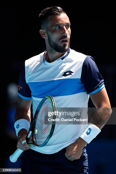 Damir Dzumhur of Bosnia and Herzegovina looks on during his Men's Singles first round match against Stan Wawrinka of Switzerland on day two of the...