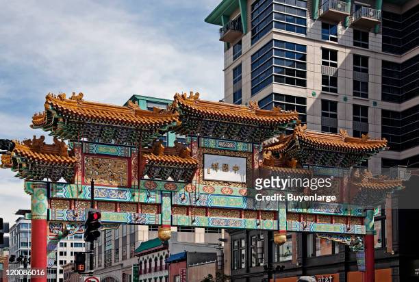 View west along H Street NW of the top of the Friendship Archway, a traditional Chinese gate that marks the Chinatown neighborhood, Washington DC,...