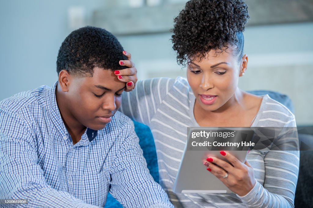 Mother on a video call with doctor with sick teenage son