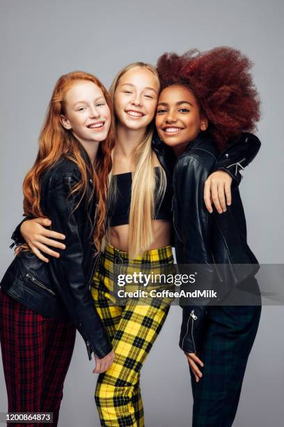 three young and happy teenage girls - three people isolated stock pictures, royalty-free photos & images