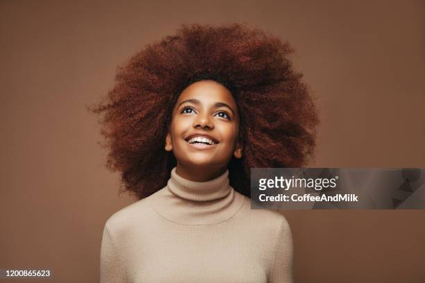 photo of young curly girl - beautiful black teen girl stock pictures, royalty-free photos & images