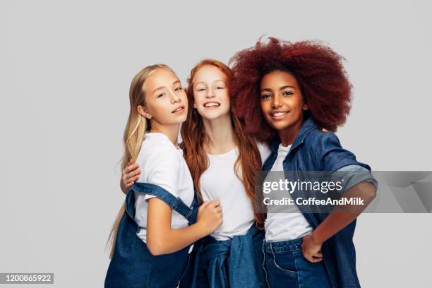 three beautiful young girls standing at the studio - preteen girl models stock pictures, royalty-free photos & images