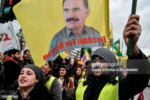 Kurdish supporters of convicted Kurdistan Worker's Party leader Abdullah Ocalan chant slogans and wave flags depicting Ocalan in central Athens,...