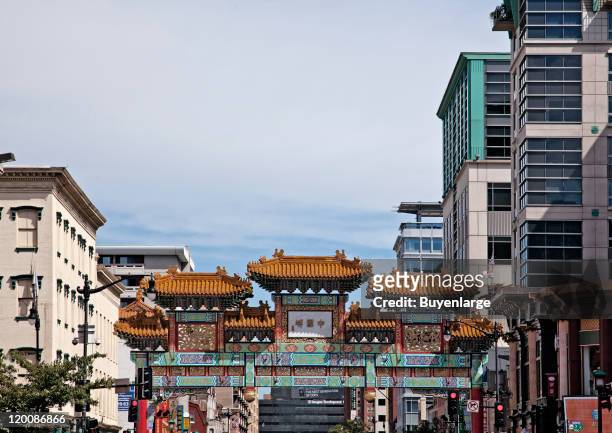 View west along H Street NW of the top of the Friendship Archway, a traditional Chinese gate that marks the Chinatown neighborhood, Washington DC,...