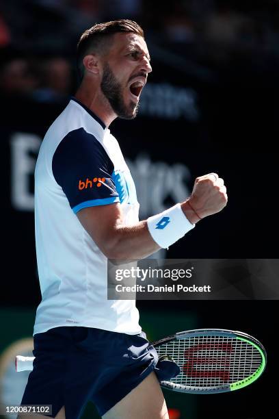 Damir Dzumhur of Bosnia and Herzegovina celebrates after winning a point during his Men's Singles first round match against Stan Wawrinka of...