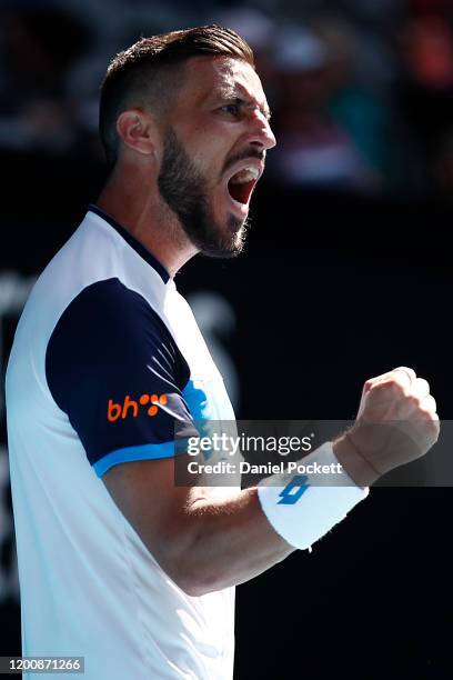 Damir Dzumhur of Bosnia and Herzegovina celebrates after winning a point during his Men's Singles first round match against Stan Wawrinka of...