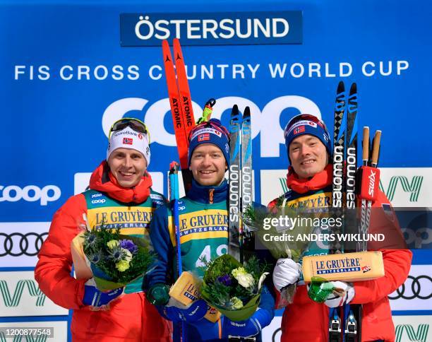 Second placed Simen Hegstad Kruger of Norway, winner Sjur Roethe of Norway and on third place Finn Haagen Krogh of Norway celebrate on the podium...