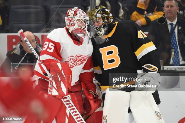 Jimmy Howard of the Detroit Red Wings talks during warms up to Jaroslav Halak of the Boston Bruins before the game at the TD Garden on February 15,...