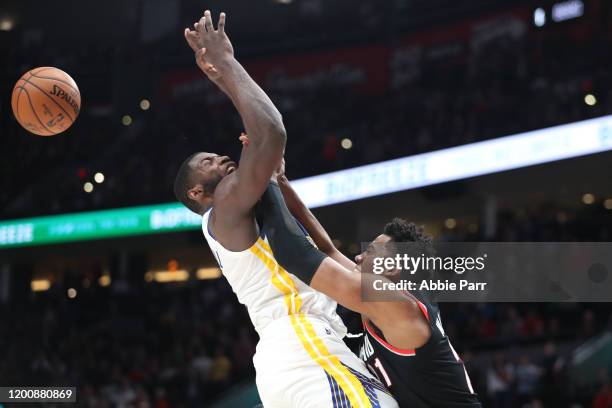 Hassan Whiteside of the Portland Trail Blazers blocks a shot against Alec Burks of the Golden State Warriors in overtime at Moda Center on January...