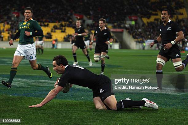 Zac Guildford of the All Blacks dives over to score a try during the Tri-Nations match between the New Zealand All Blacks and the South African...