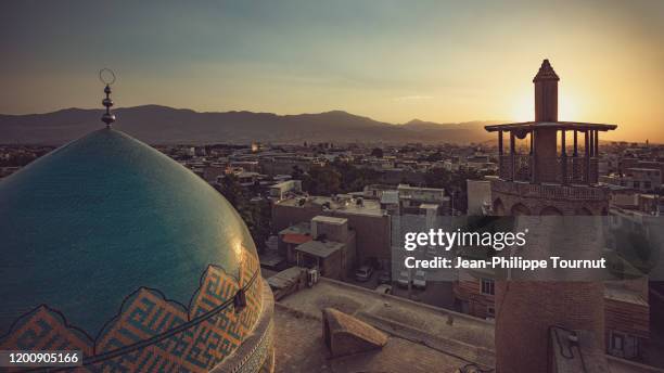 sunset on the roof of one of the oldest mosque of iran, masjid-e-jameh, jameh mosque of borujerd, lorestan province, iran - shia mosque stock pictures, royalty-free photos & images
