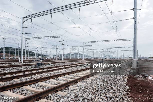 high-speed train tracks and power grids - south china fotografías e imágenes de stock