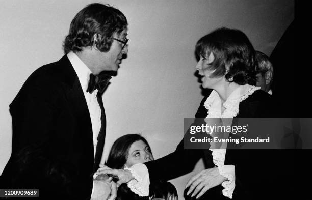 British actor Michael Caine and American actress Shirley MacLaine at the first night party for MacLaine's one-woman show at the London Palladium, at...