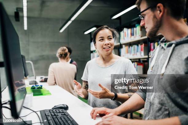 College Students Working In Library Photos and Premium High Res ...