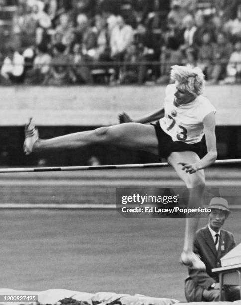 Romanian athlete Iolanda Balas in competition to finish in first place to win the gold medal for Romania in the Women's high jump event at the 1964...