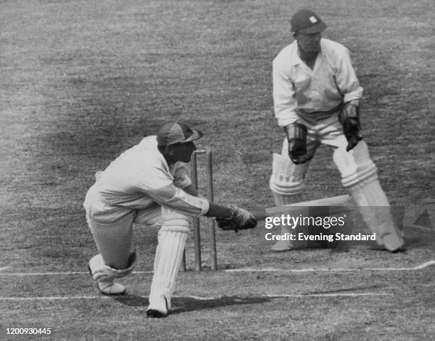 Surrey batsman Douglas Jardine swipes a loose ball from Jarrett to the boundary on the third and last day of a County Championship, match against...