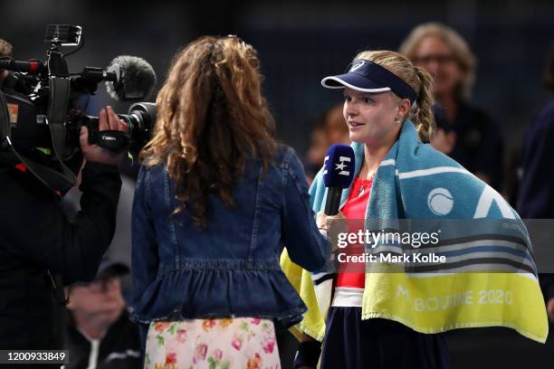 Harriet Dart of Great Britain is interviewed on court after winning her Women's Singles first round match against Misaki Doi of Japanon day two of...