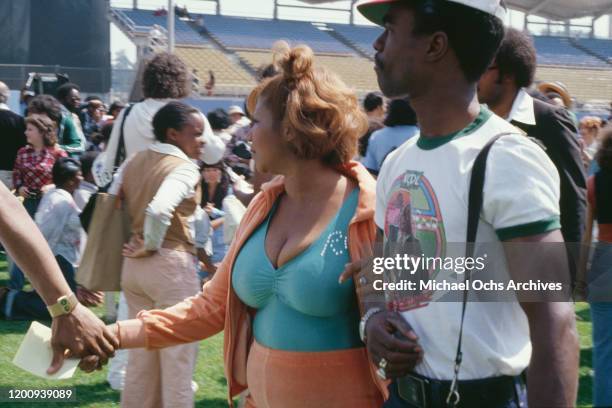 American singer, songwriter, pianist, and civil rights activist Aretha Franklin and her husband Glynn Turman attend the PUSH-Excel-A-thon held at...