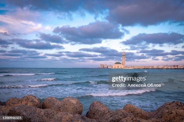 the hassan ii mosque in casablanca at sunset - casablanca morocco stock pictures, royalty-free photos & images